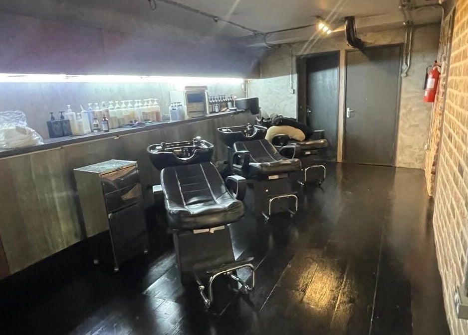 Stylish salon wash stations at Hayato London, located in London, England, GB, featuring sleek black chairs.