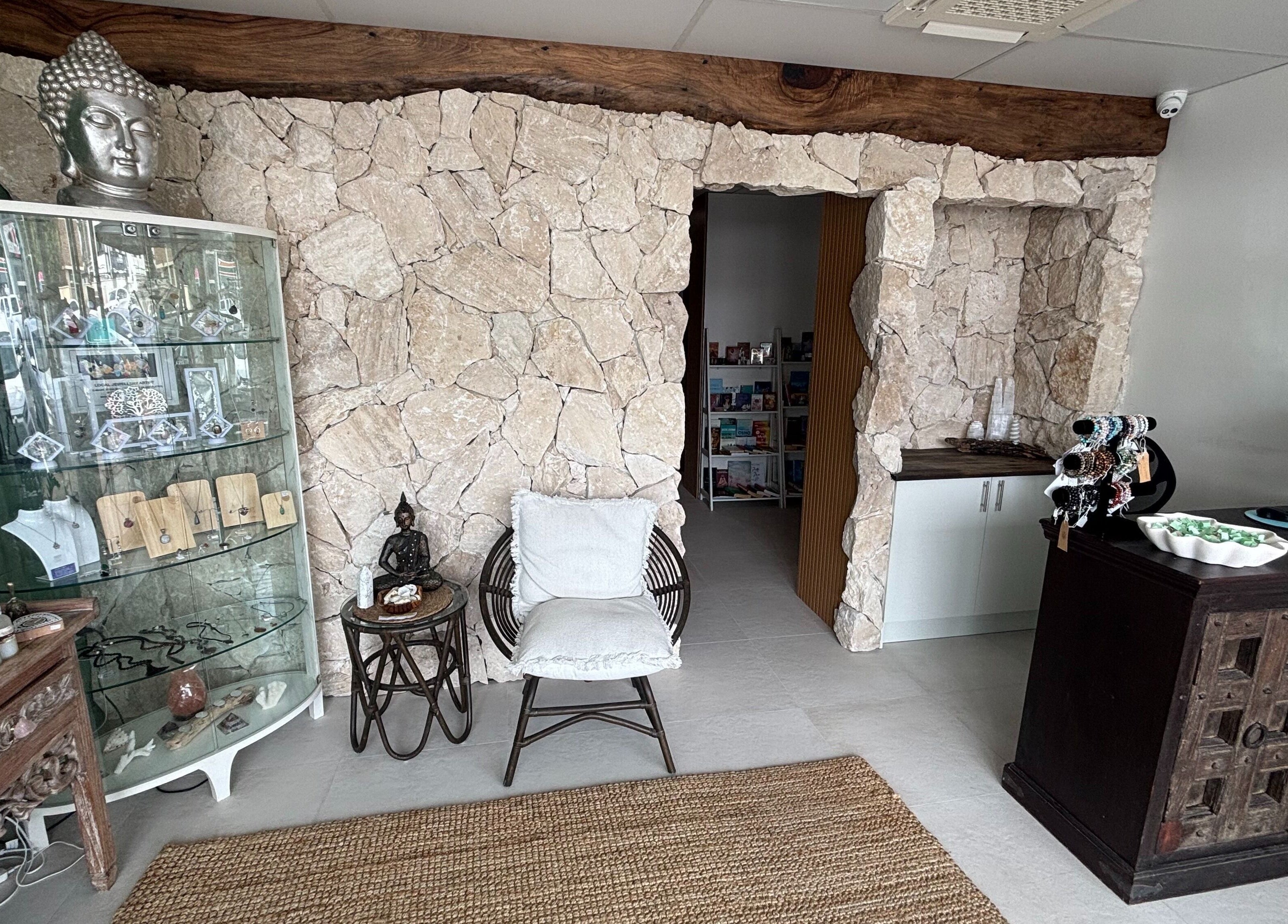 Welcoming rustic stone interior at The Healing Cottage, Palm Beach, Queensland, AU, offering a soothing atmosphere.