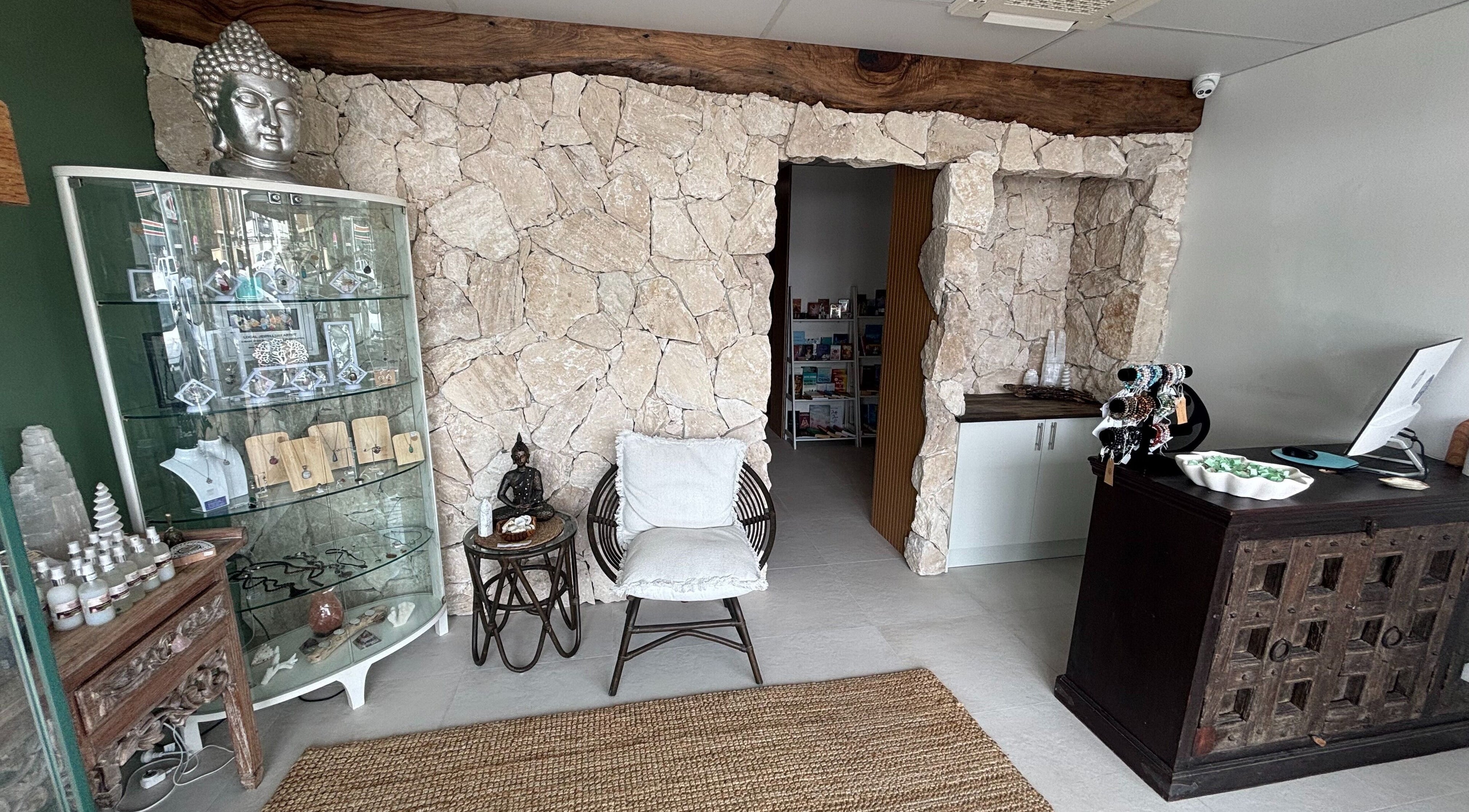 Welcoming rustic stone interior at The Healing Cottage, Palm Beach, Queensland, AU, offering a soothing atmosphere.