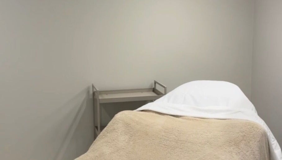 Calming treatment room at L.A Facial Aesthetics, Saltash, England, GB, featuring a comfortable, inviting spa bed.