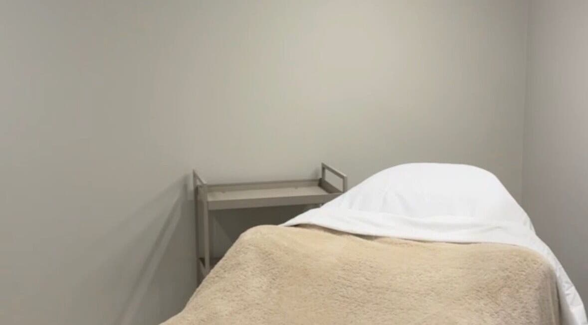Calming treatment room at L.A Facial Aesthetics, Saltash, England, GB, featuring a comfortable, inviting spa bed.