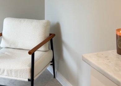 Relaxing spa chair and lit candle at L.A Facial Aesthetics, Saltash, England, GB.