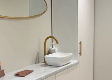 Modern wash basin with gold faucet at L.A Facial Aesthetics, Saltash, England, GB.