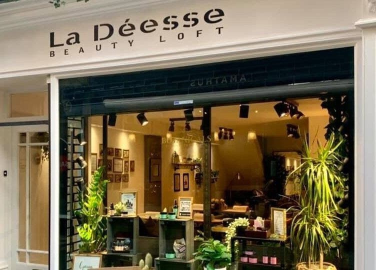 Exterior of La Déesse Beauty Loft in Bath, England, GB showcasing elegant signage and inviting decor.