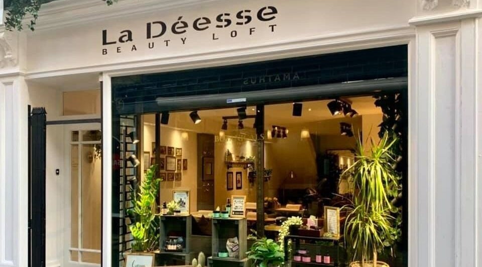 Exterior of La Déesse Beauty Loft in Bath, England, GB showcasing elegant signage and inviting decor.