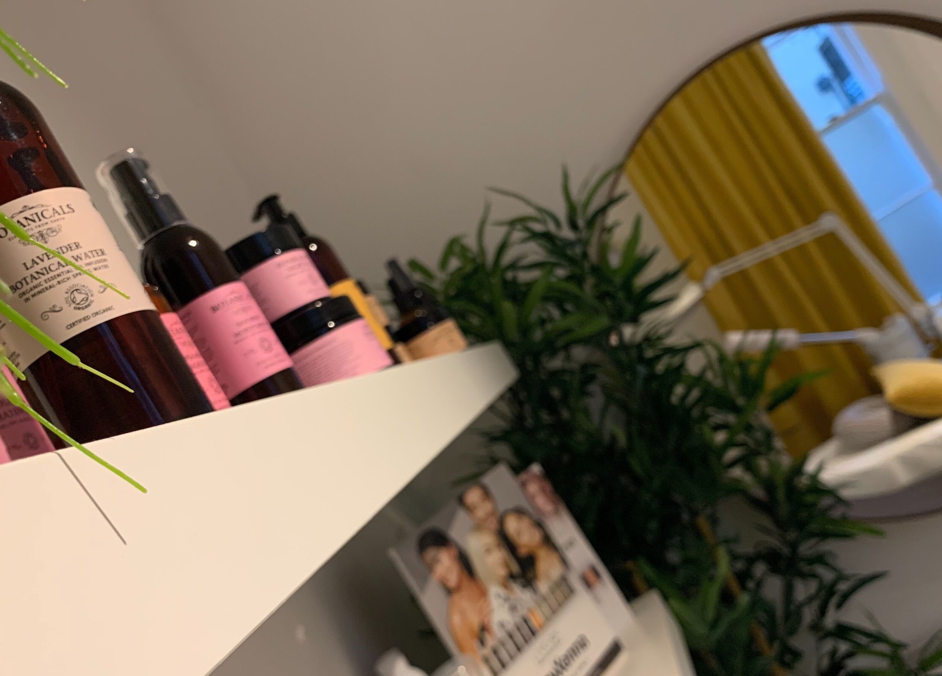 Shelf with beauty products at La Déesse Beauty Loft, Bath, England, GB, reflecting tranquil ambiance.