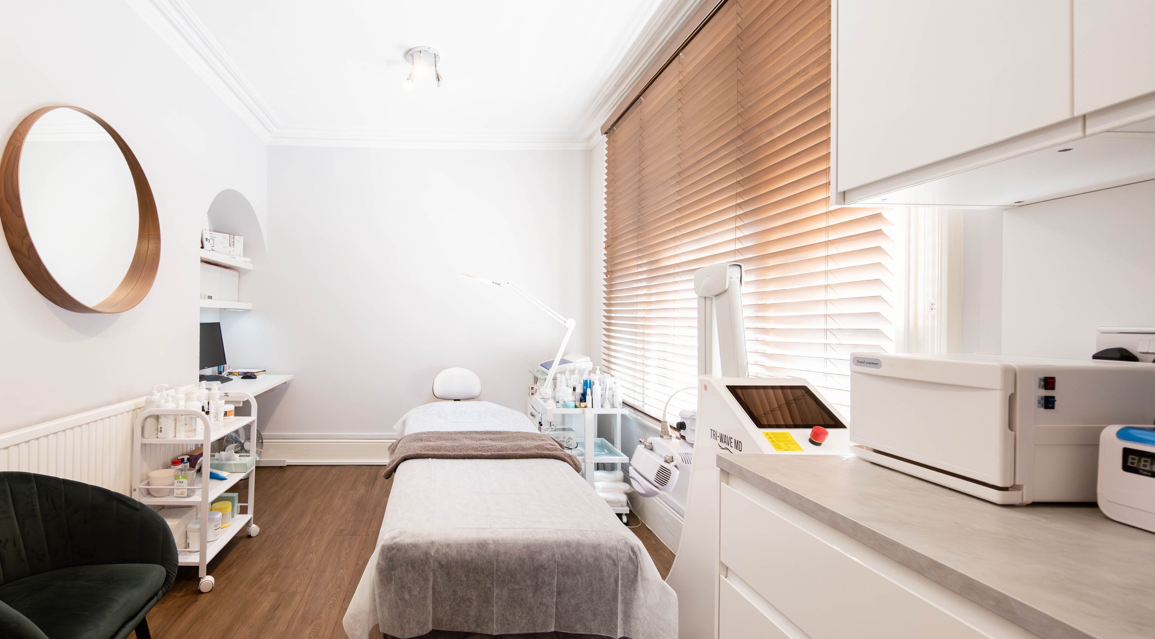 Modern treatment room at Meta Beauty in London, England, GB. Minimalist decor with advanced skincare equipment.