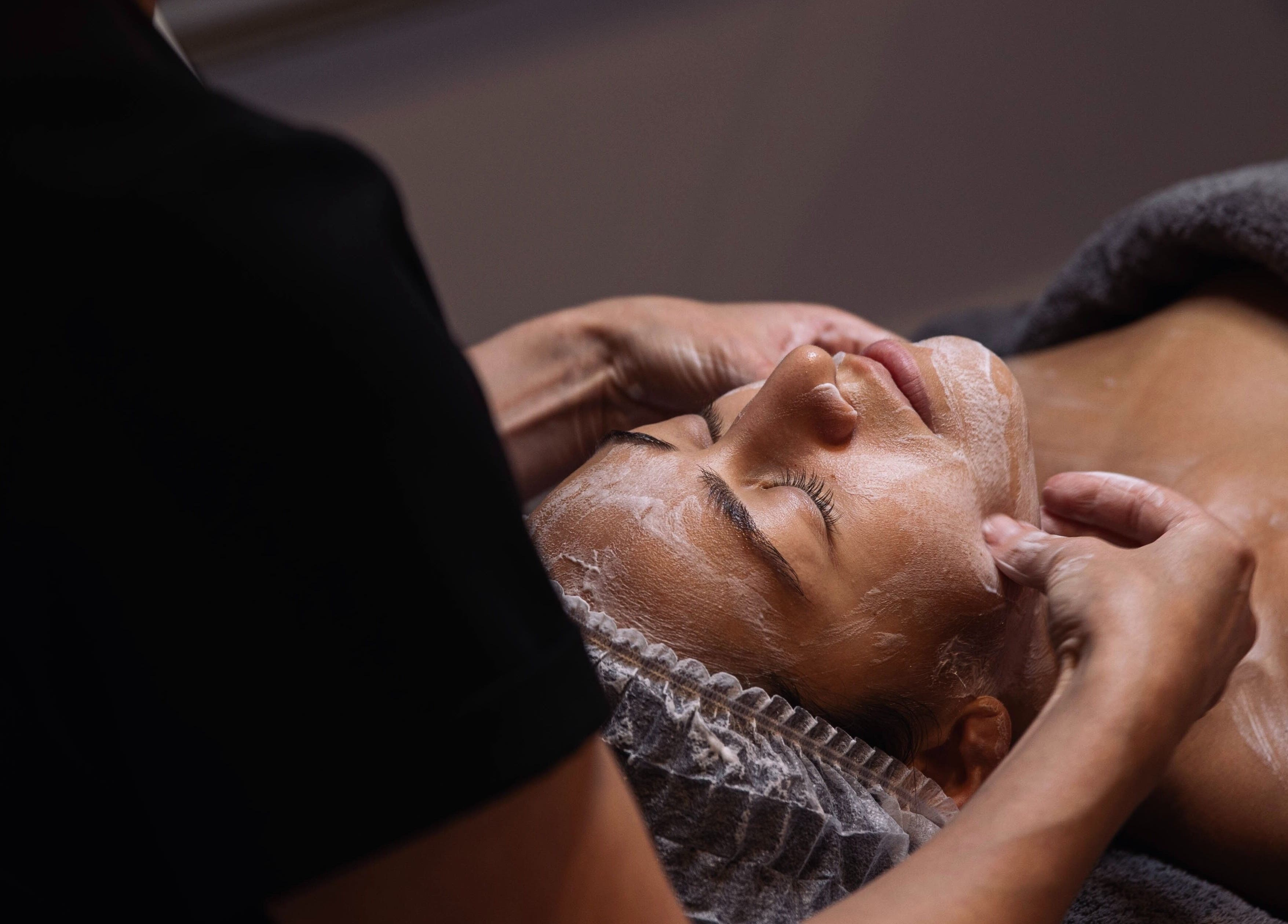 A tranquil facial massage at Meta Beauty, London, England, GB, showcasing relaxation and care.