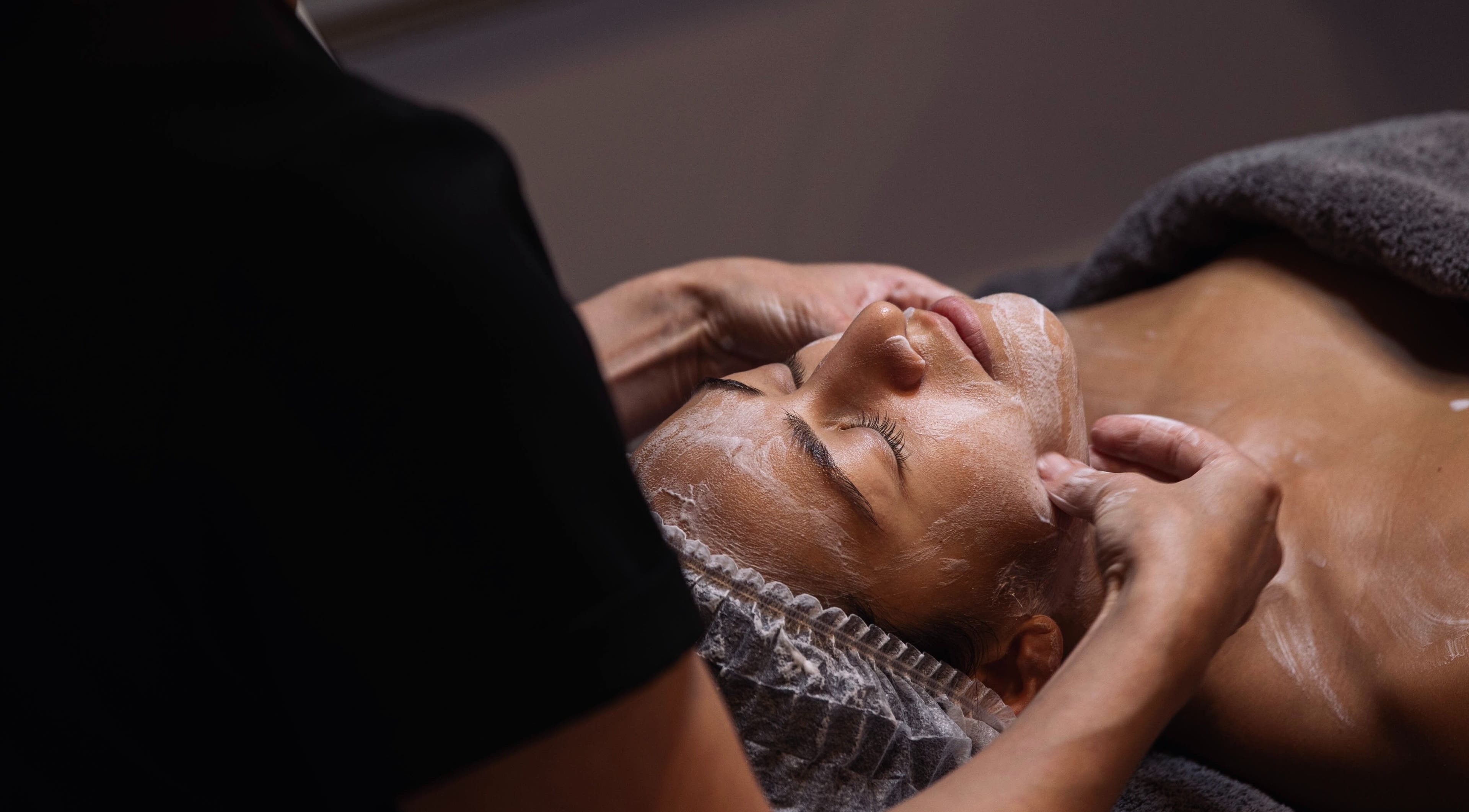 A tranquil facial massage at Meta Beauty, London, England, GB, showcasing relaxation and care.
