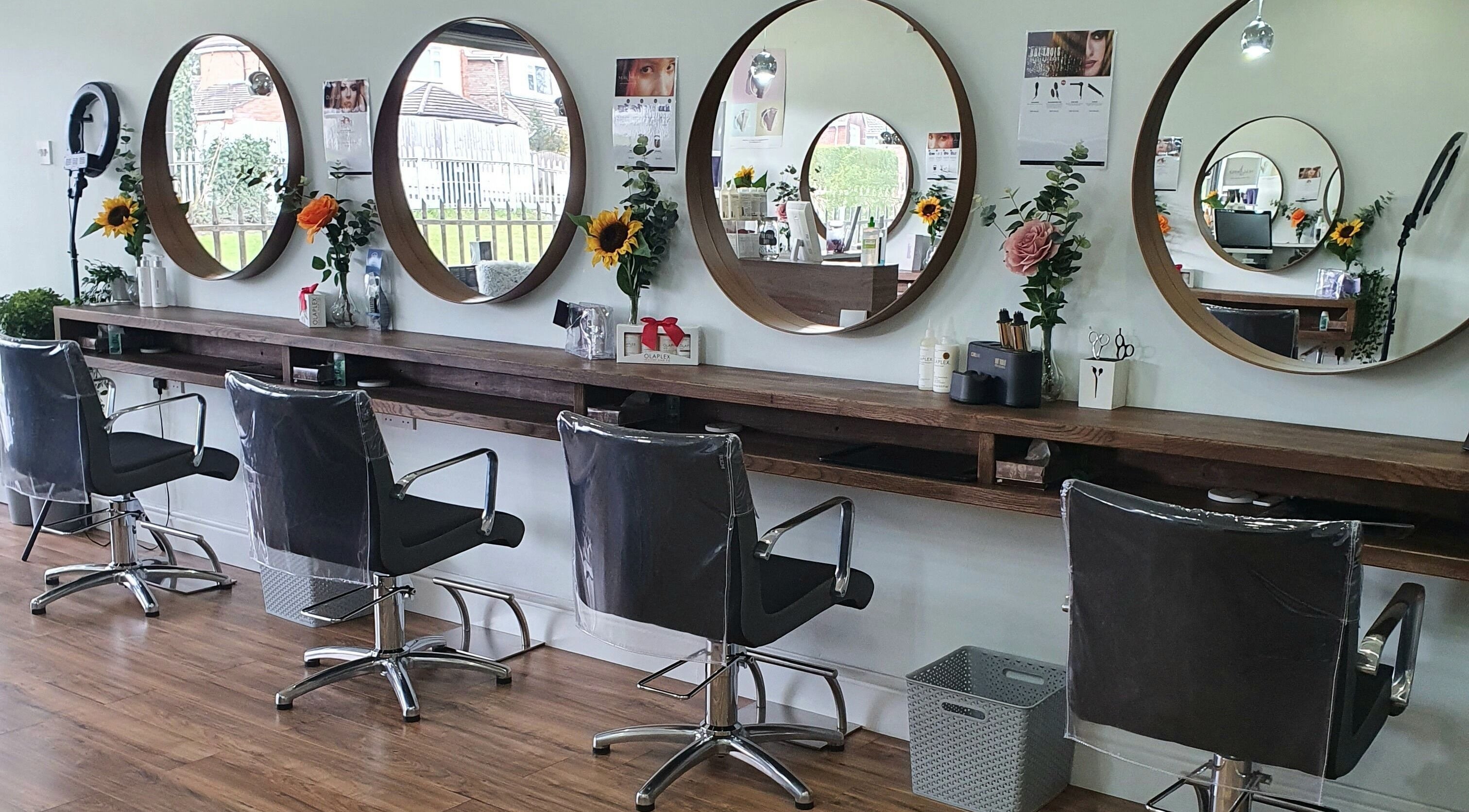 Chic salon interior with mirrors and chairs at Hair by Teri, Birkenhead, England, GB.