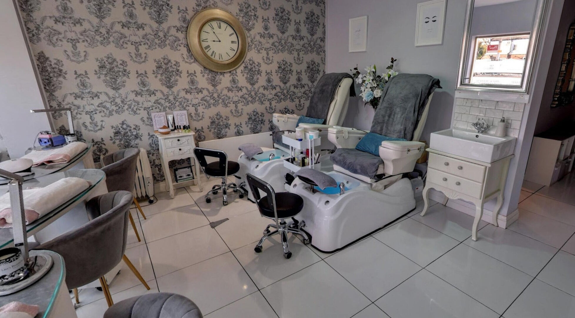 Cozy pedicure and manicure area at Lisa's Beauty Spot, Amersham, England, GB, featuring plush seating.