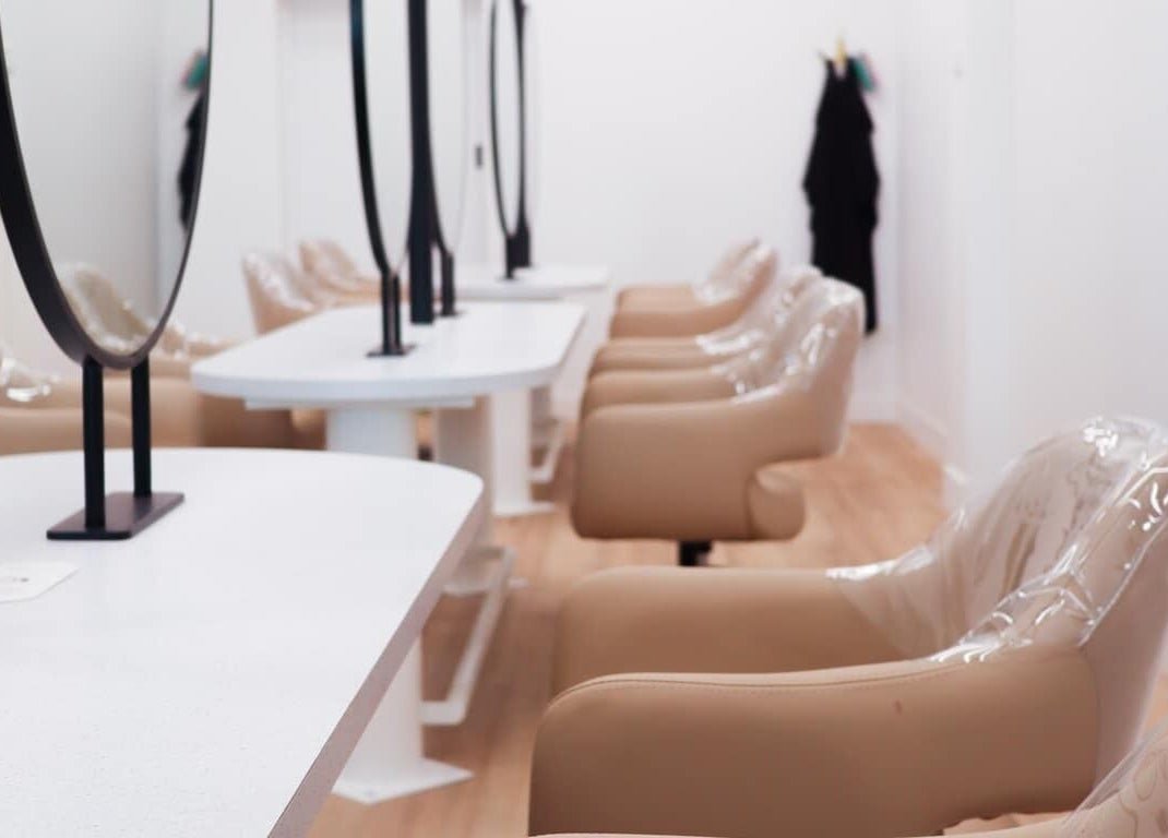 Interior of Lily Me Red IPSWICH beauty salon in North Ipswich, Queensland, AU with sleek styling stations.