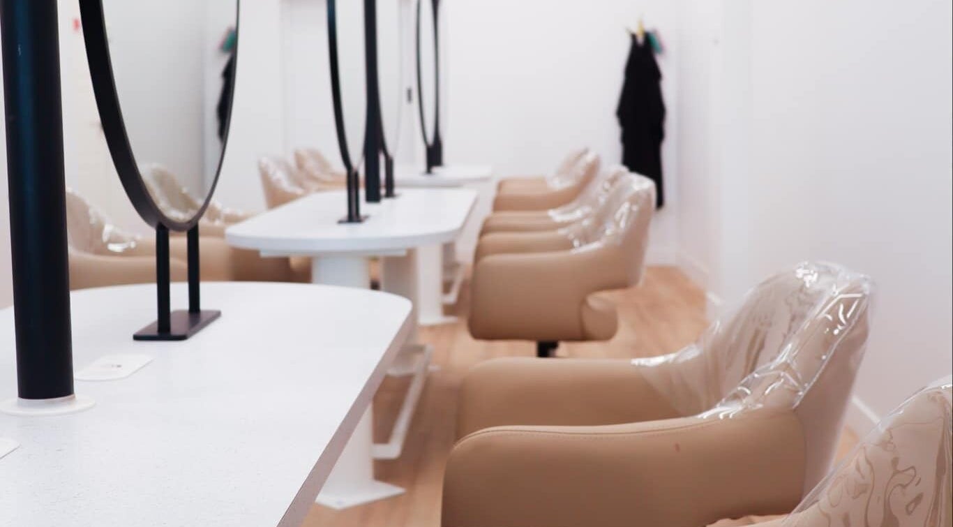 Interior of Lily Me Red IPSWICH beauty salon in North Ipswich, Queensland, AU with sleek styling stations.