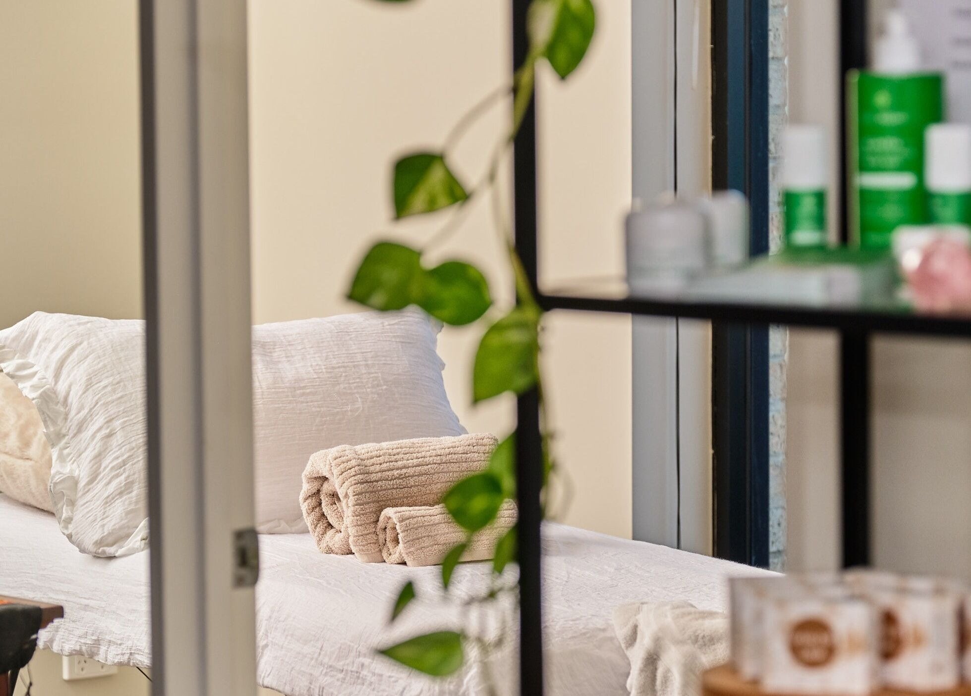 Relaxing massage room at My Balance Massage, Withers, Western Australia, AU, with towels and greenery.