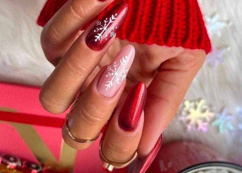 Elegant red and pink nails with snowflake design at Serena Nails and Spa in Burlington, Massachusetts, US.