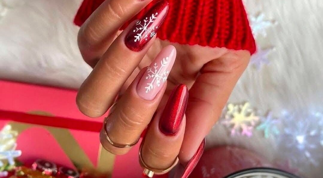 Elegant red and pink nails with snowflake design at Serena Nails and Spa in Burlington, Massachusetts, US.