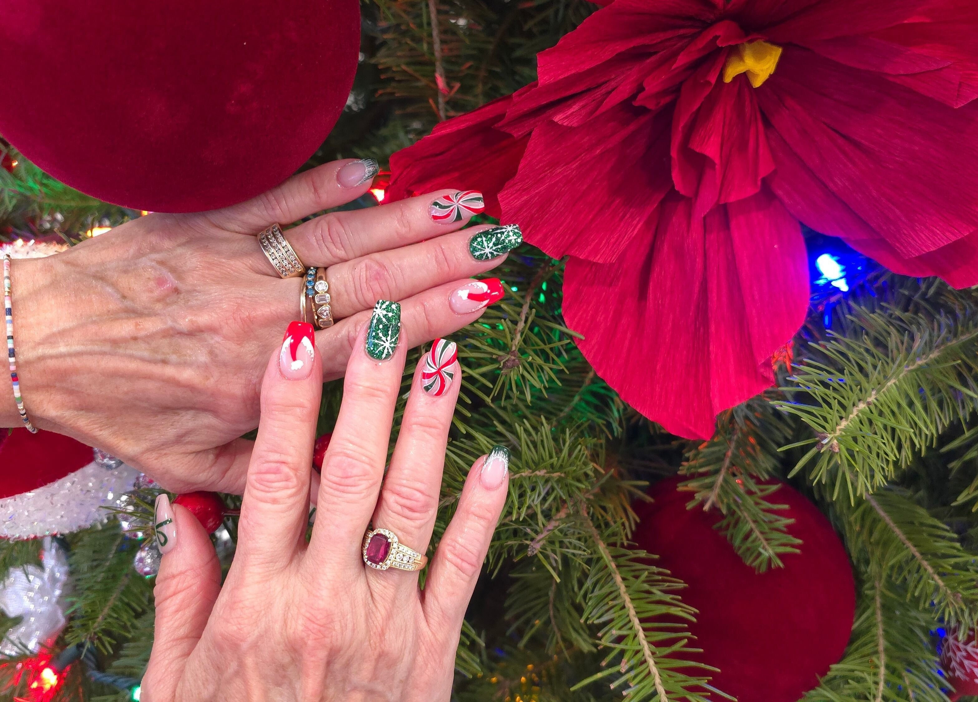 Holiday-themed manicured nails at Serena Nails and Spa in Burlington, Massachusetts, US amidst festive decor.