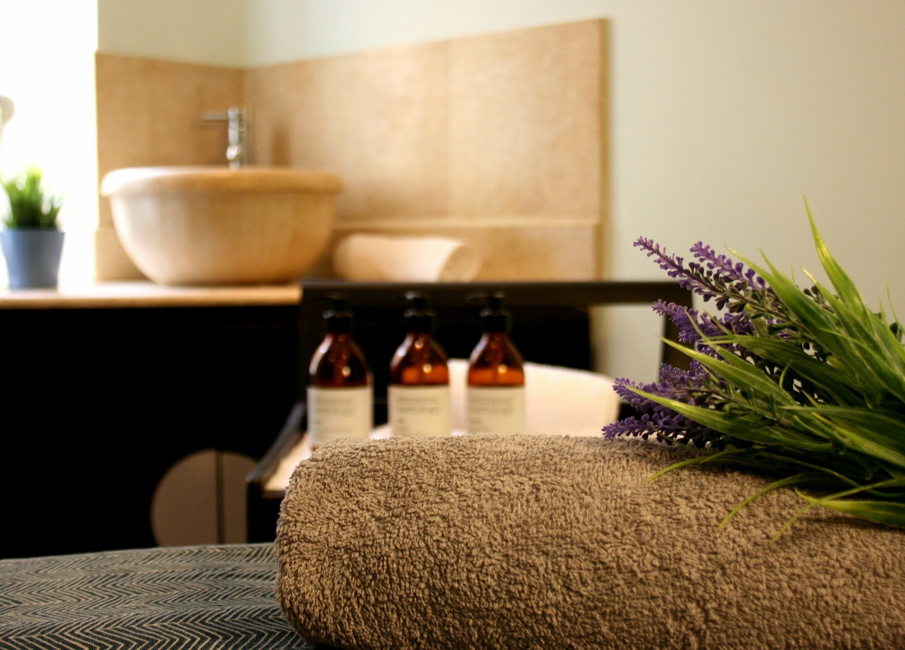 Relaxing spa setup with lavender and rolled towel at The Spa at St Giles, Norwich, England, GB.