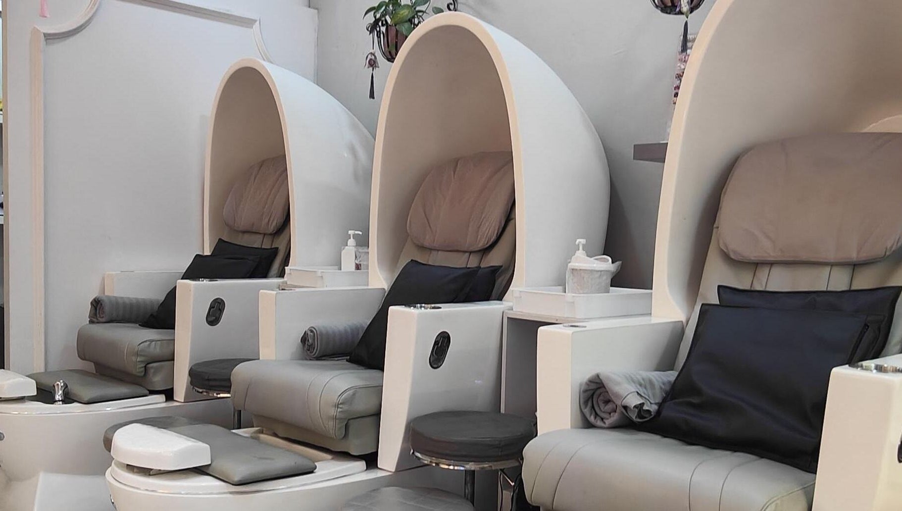 Luxurious pedicure chairs at Finger Bar and Studio, Singapore, Singapore, SG offer relaxation and comfort.