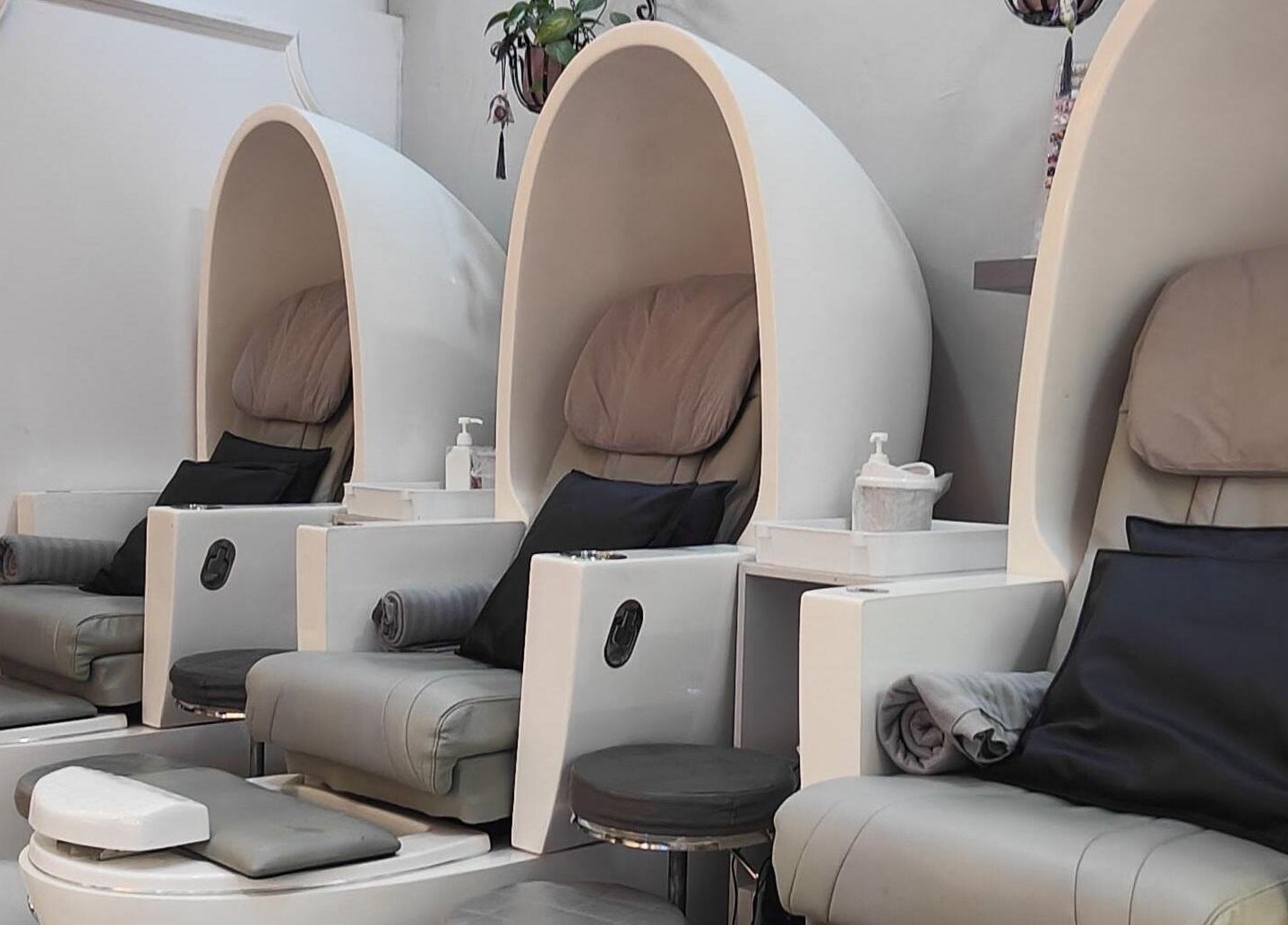 Luxurious pedicure chairs at Finger Bar and Studio, Singapore, Singapore, SG offer relaxation and comfort.
