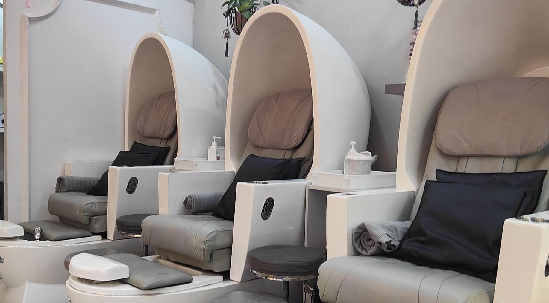 Luxurious pedicure chairs at Finger Bar and Studio, Singapore, Singapore, SG offer relaxation and comfort.