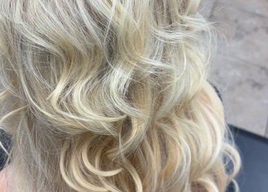 Elegant blonde curls styled at Hair by Angelia Chandler Austin in Jonesboro, Arkansas, US.