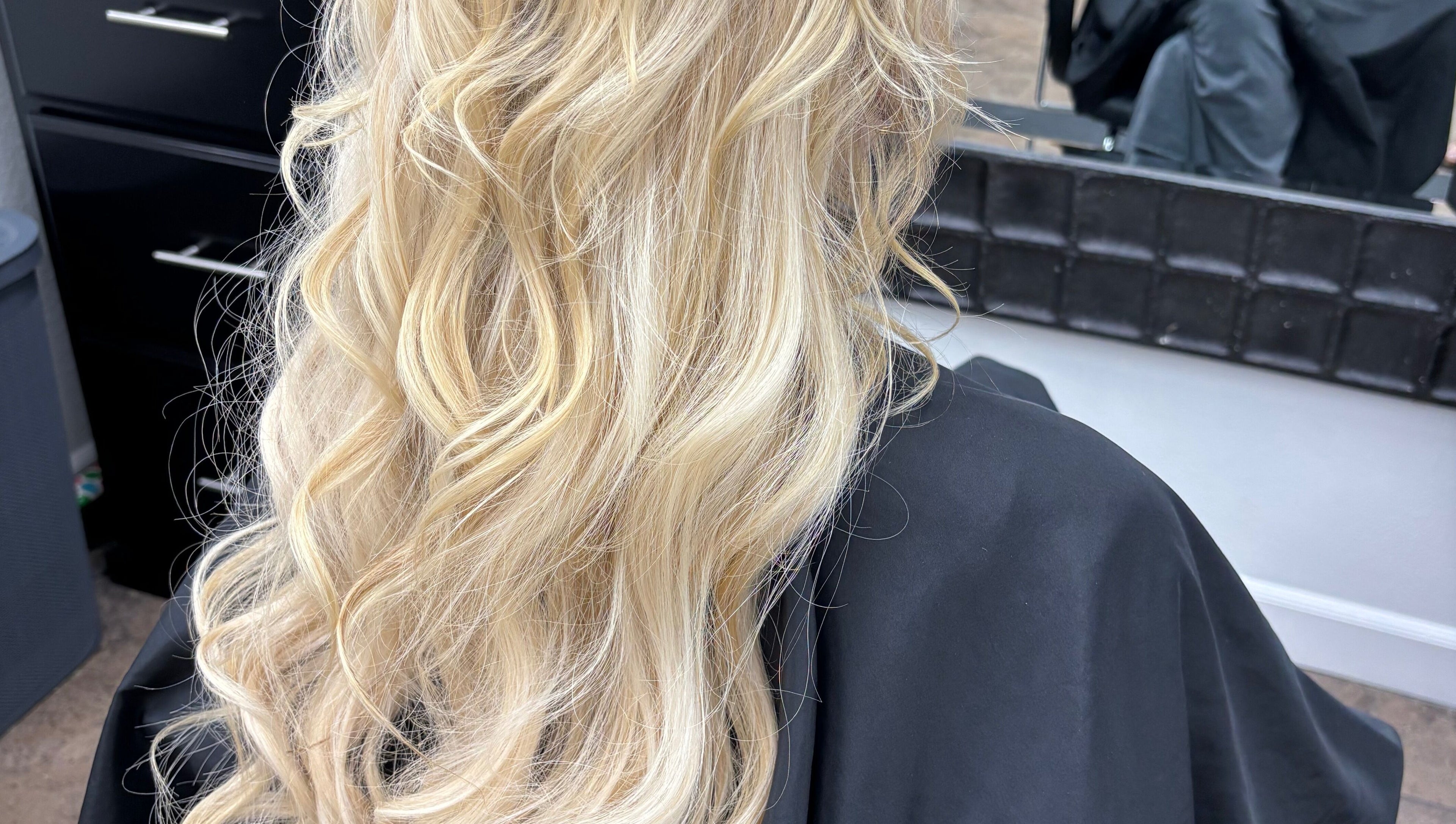 Blonde hair styled in soft waves at Hair by Angelia Chandler-Austin, Jonesboro, Arkansas, US salon.