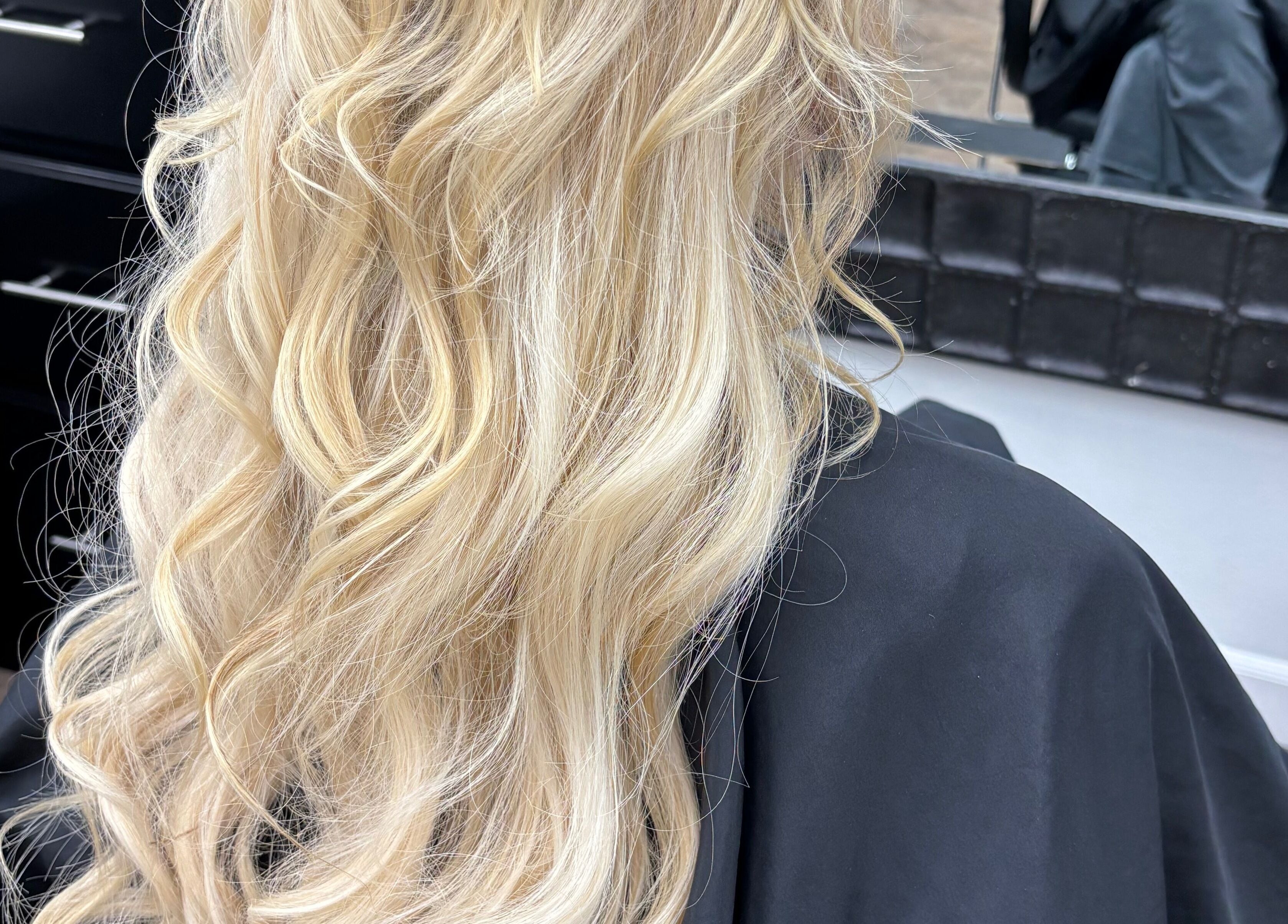 Blonde hair styled in soft waves at Hair by Angelia Chandler-Austin, Jonesboro, Arkansas, US salon.
