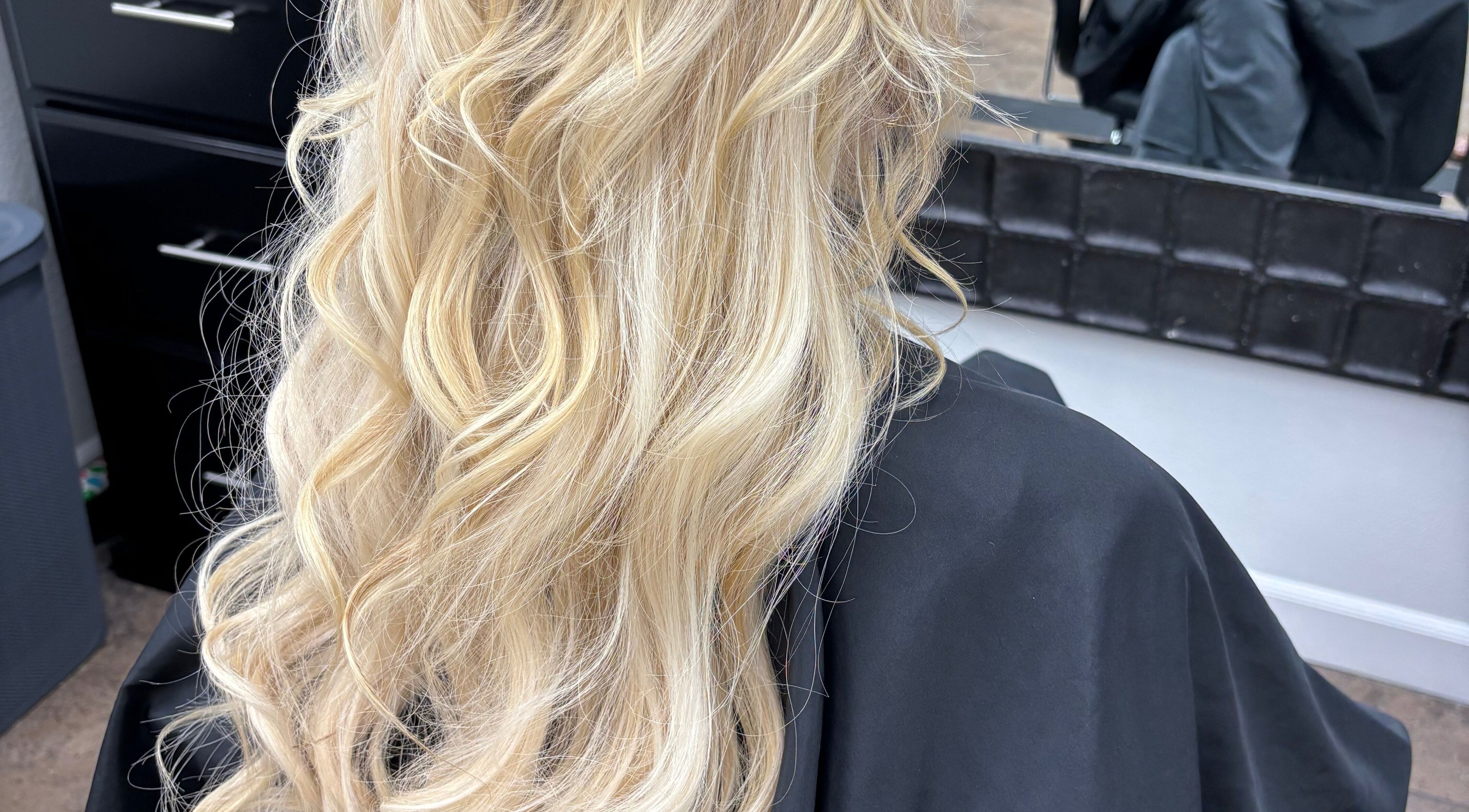 Blonde hair styled in soft waves at Hair by Angelia Chandler-Austin, Jonesboro, Arkansas, US salon.