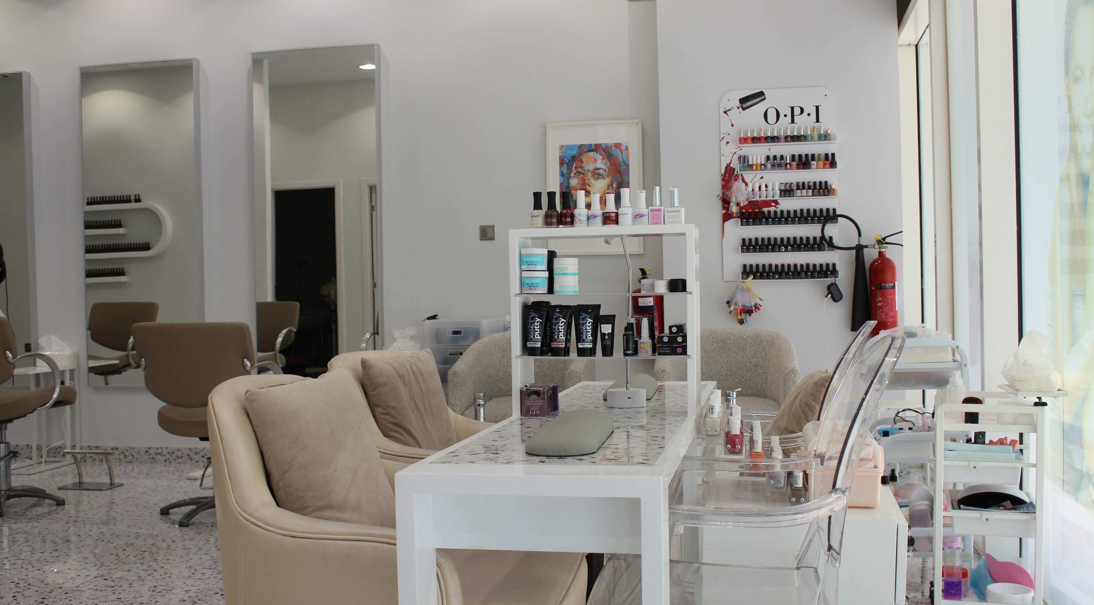 Sophisticated interior of Seier Shades Salon featuring nail polish shelves and stylish chairs in Dubai, Dubai, AE.