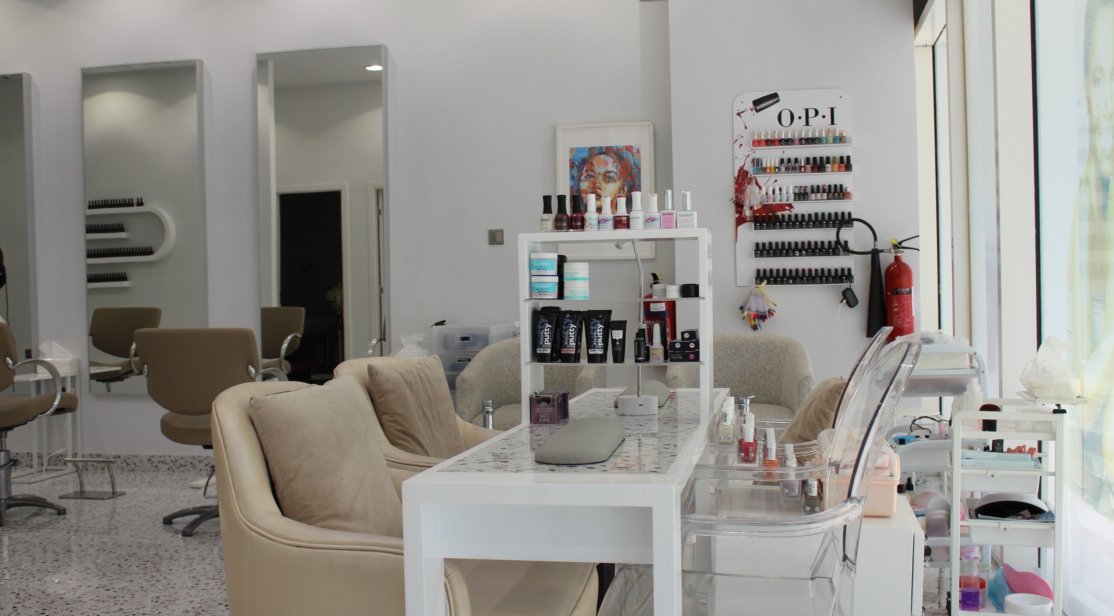 Sophisticated interior of Seier Shades Salon featuring nail polish shelves and stylish chairs in Dubai, Dubai, AE.