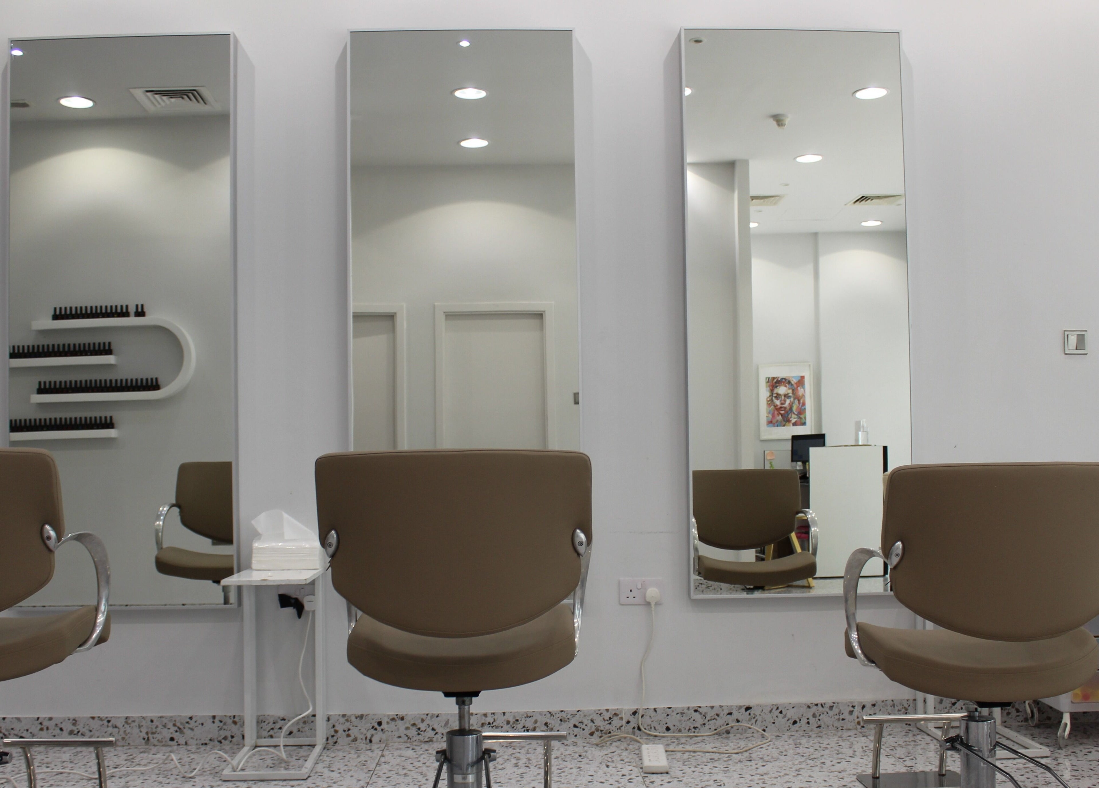 Stylish salon seating and mirrors at Seier Shades Salon, Dubai, Dubai, AE, offering a serene grooming experience.