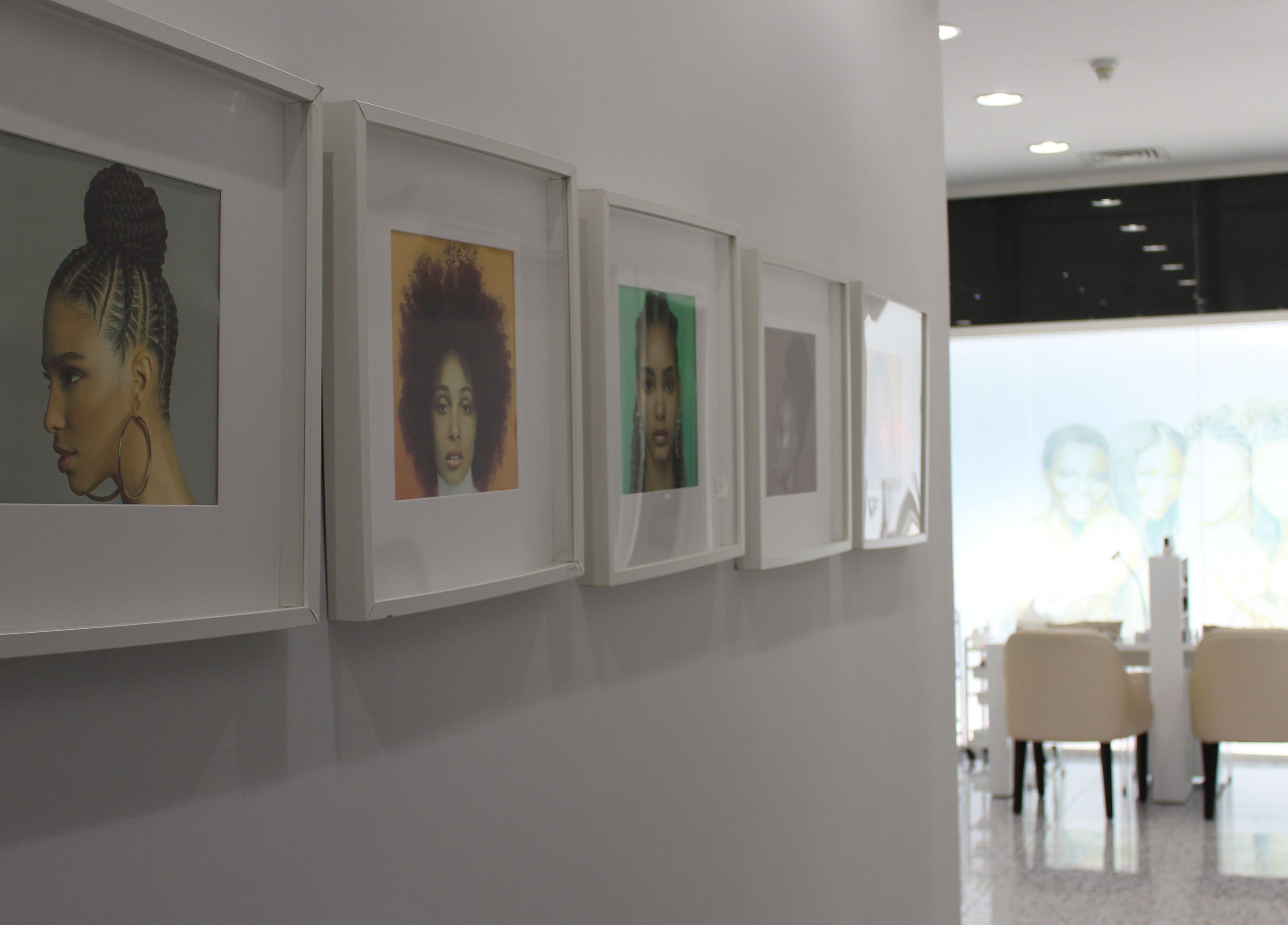 Elegant hallway with framed art at Seier Shades Salon, Dubai, Dubai, AE.