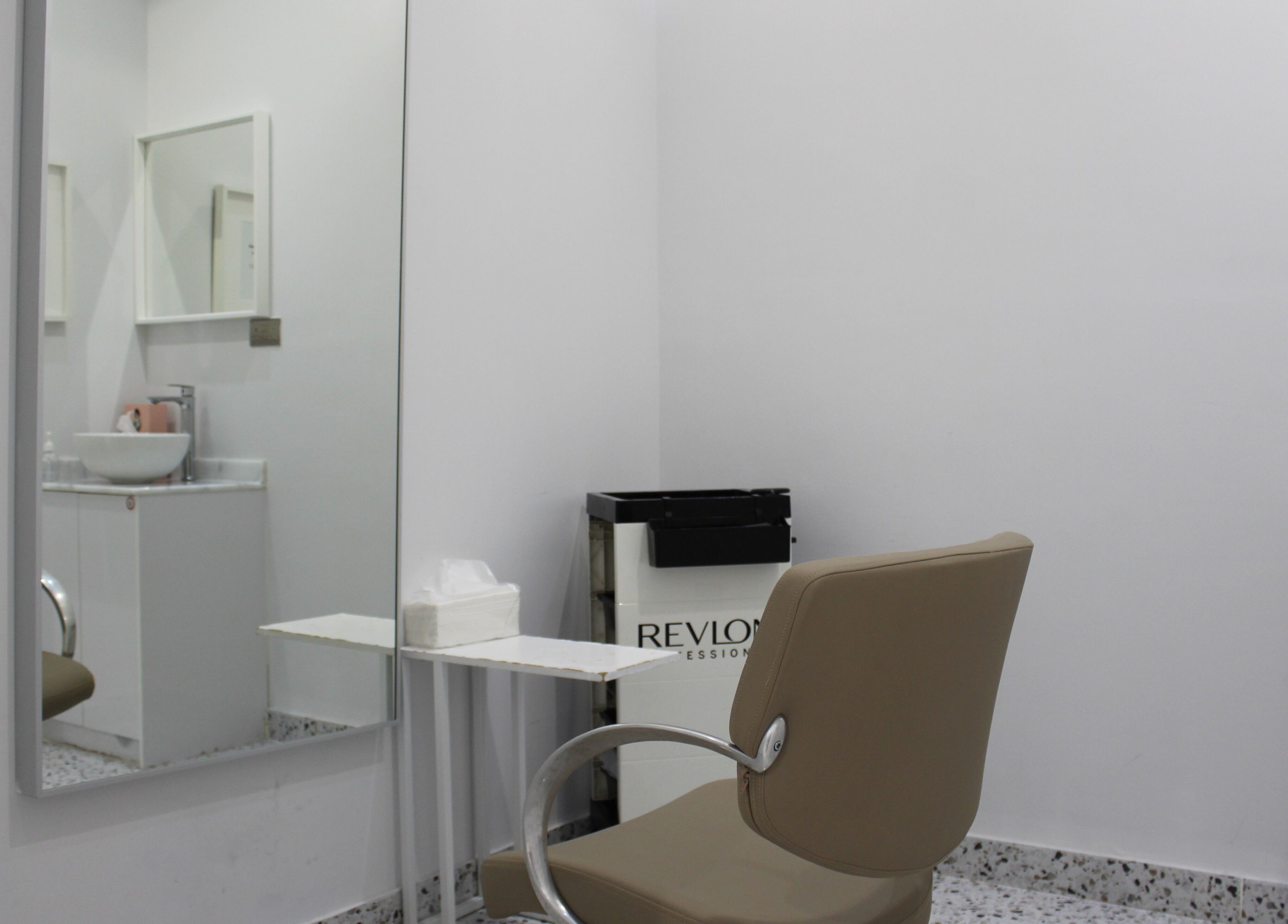 Elegant styling station at Seier Shades Salon, Dubai, Dubai, AE, featuring a modern chair and mirror.