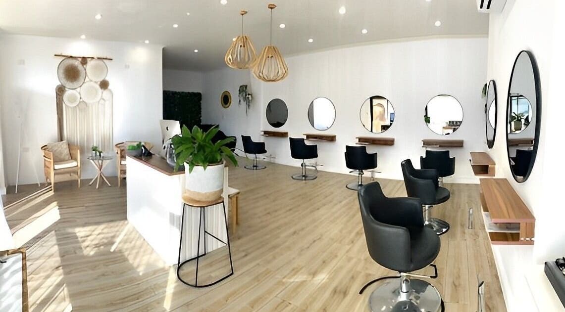 Modern salon interior at Organic Hair Co. Wellness in Terrey Hills, New South Wales, AU with stylish decor and seating.