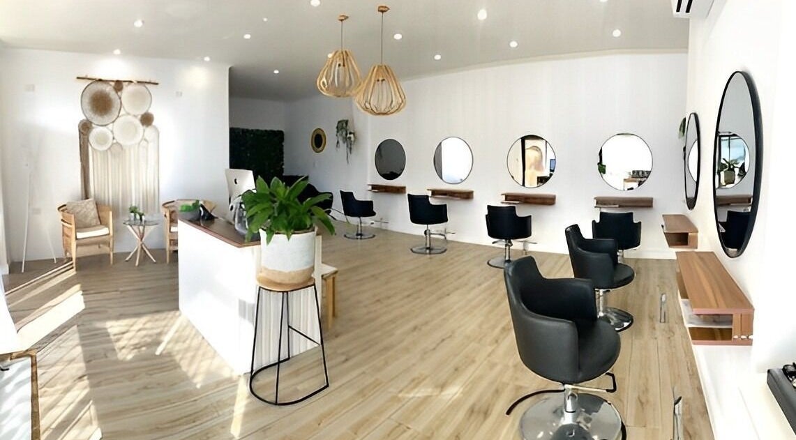Modern salon interior at Organic Hair Co. Wellness in Terrey Hills, New South Wales, AU with stylish decor and seating.