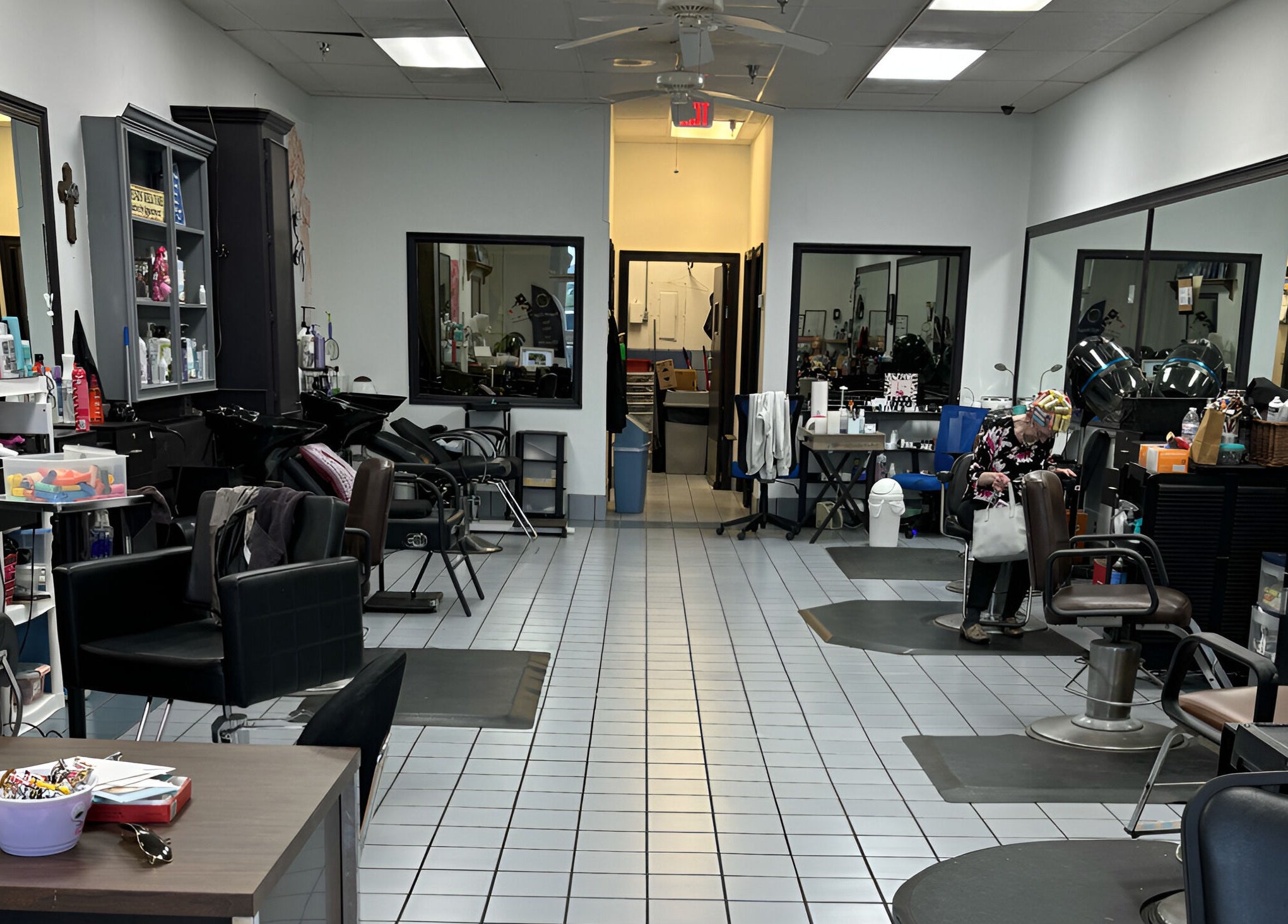 Interior of Razors Edge Hair Salon in Hattiesburg, Mississippi, US; modern chairs and styling stations.