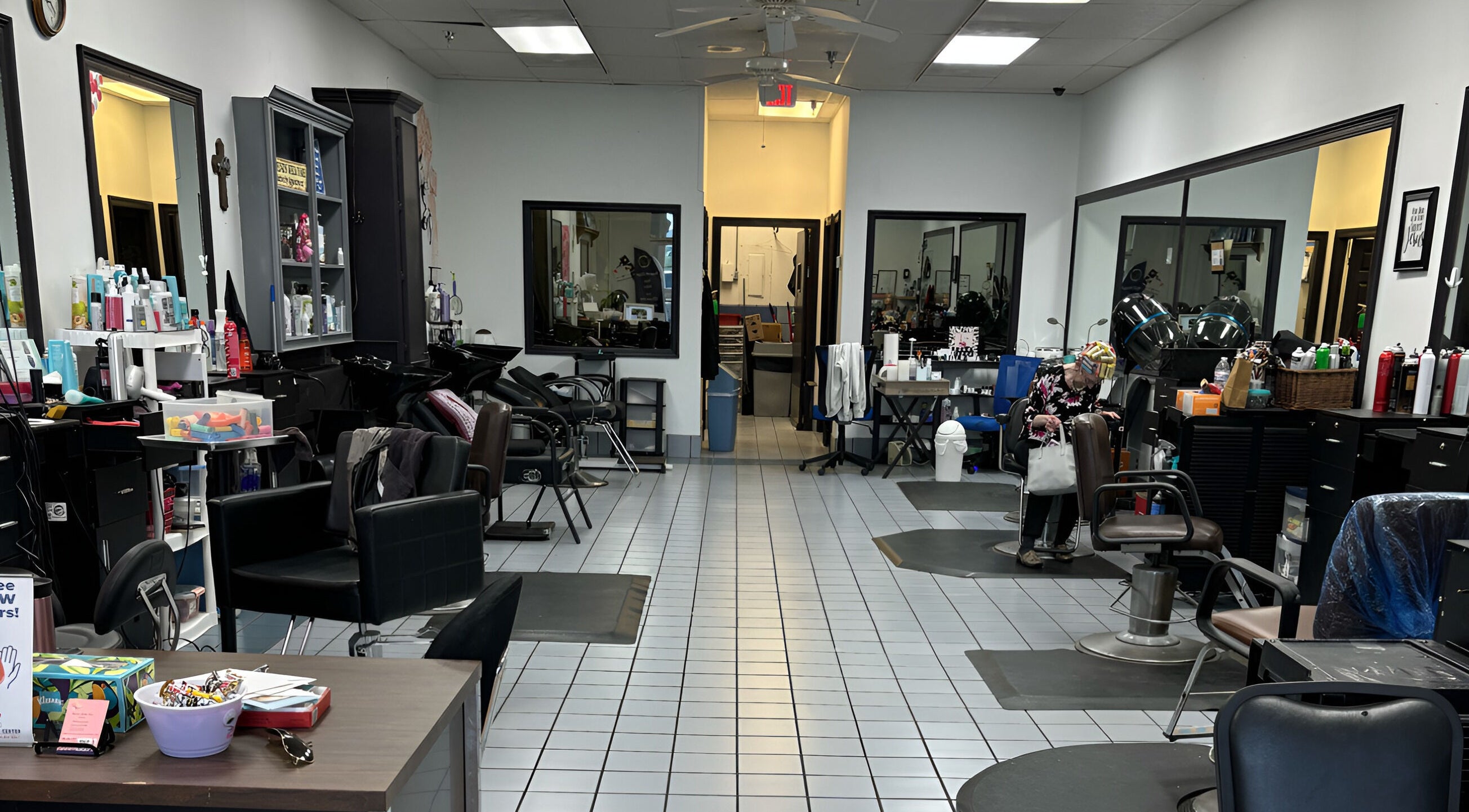 Interior of Razors Edge Hair Salon in Hattiesburg, Mississippi, US; modern chairs and styling stations.