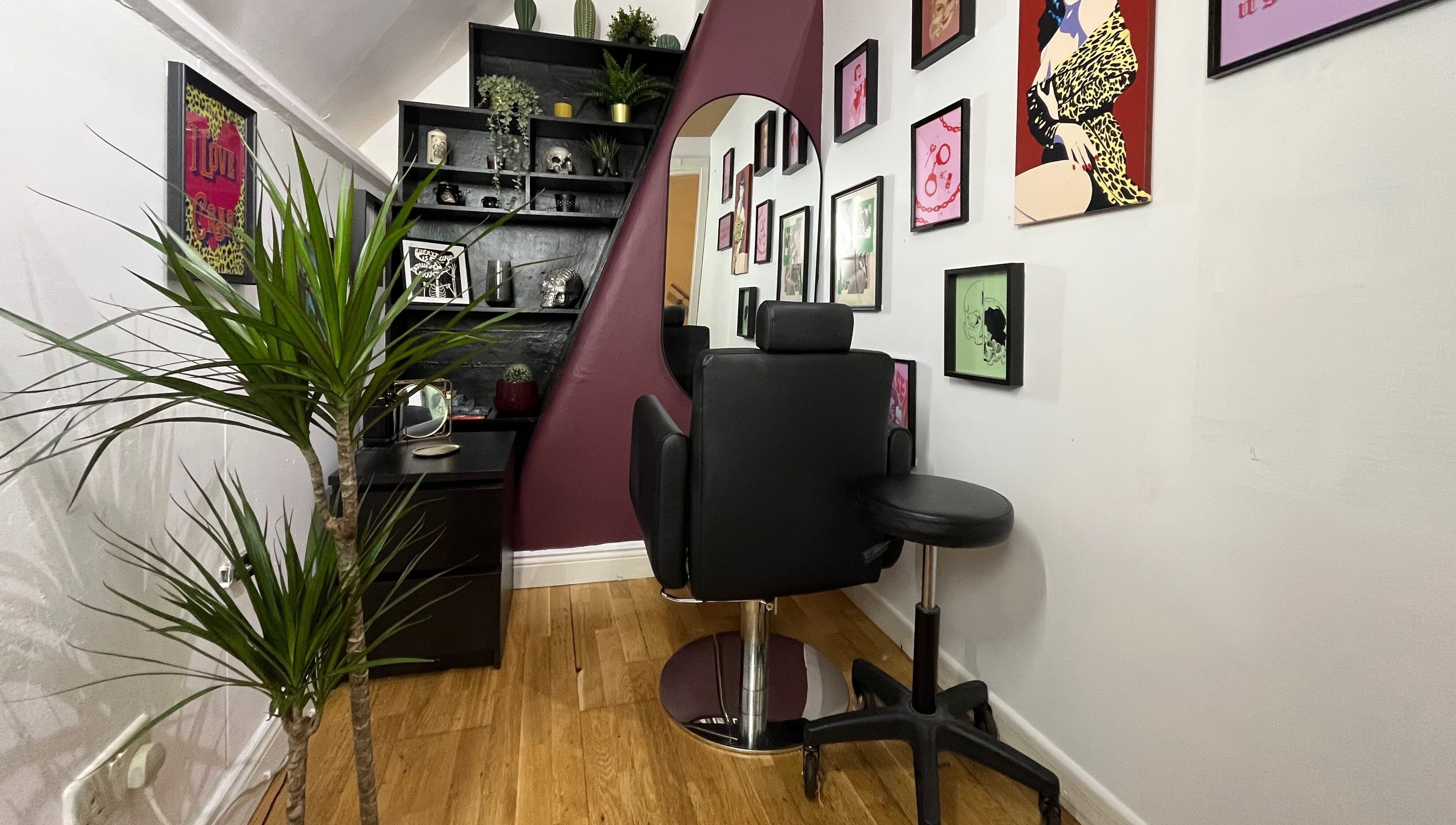 A cozy styling area at Kath Mulhall Brows, Dublin, featuring chic decor and plush chairs.