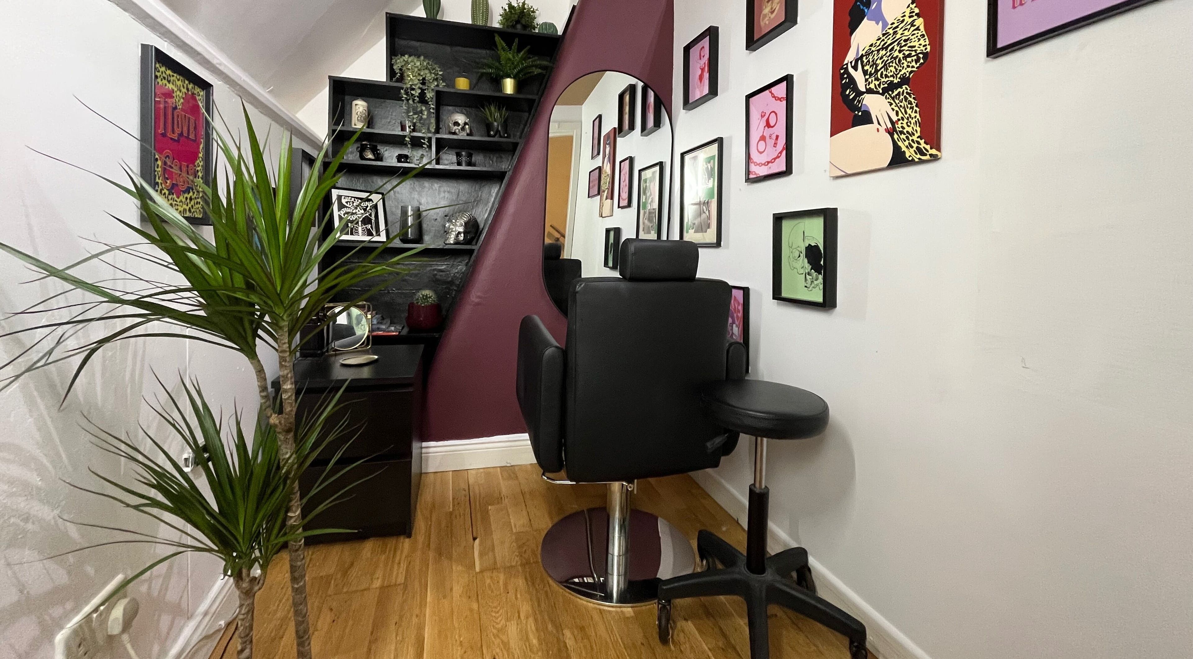 A cozy styling area at Kath Mulhall Brows, Dublin, featuring chic decor and plush chairs.