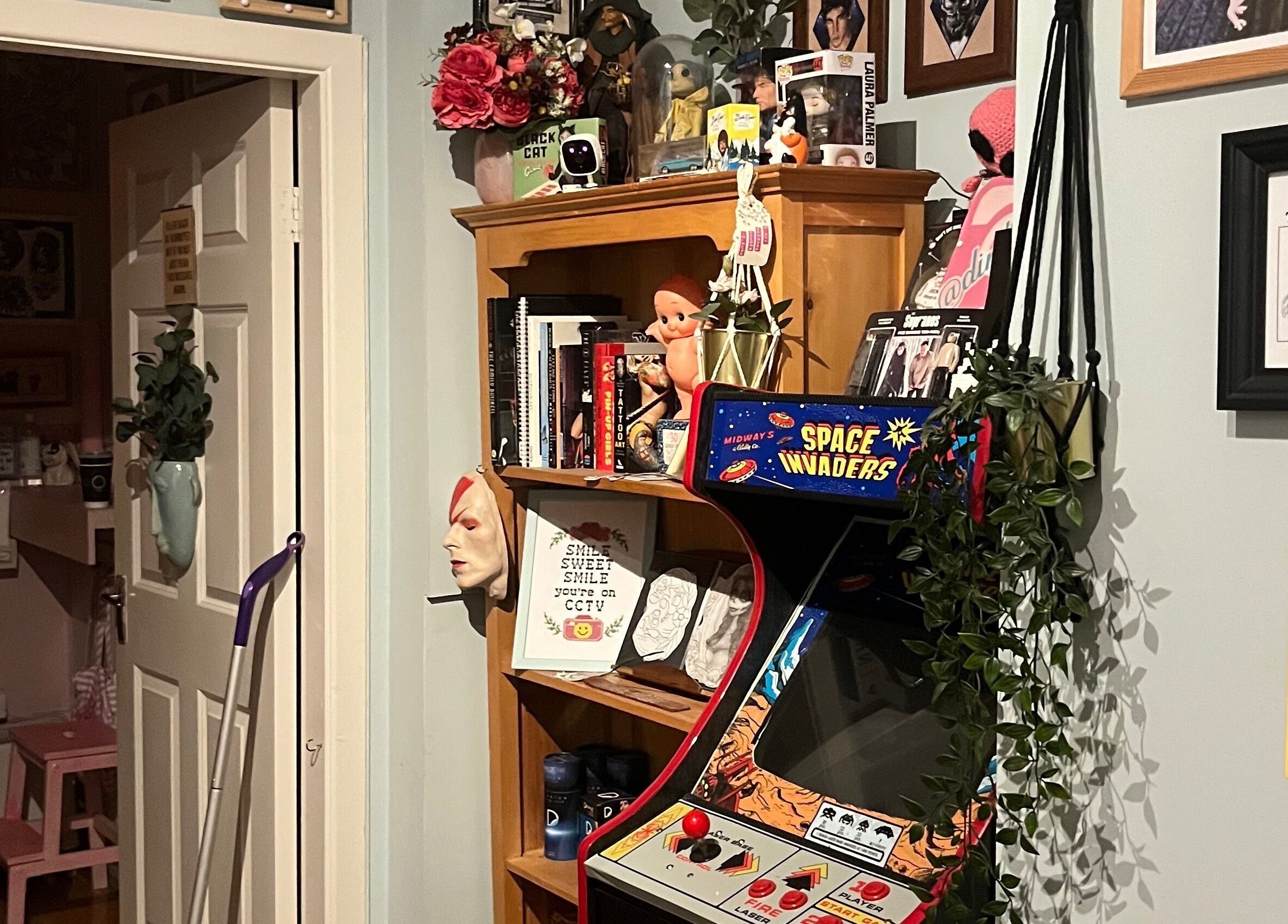 Cozy eclectic corner at Kath Mulhall Brows in Dublin, County Dublin, IE with a vintage arcade machine.