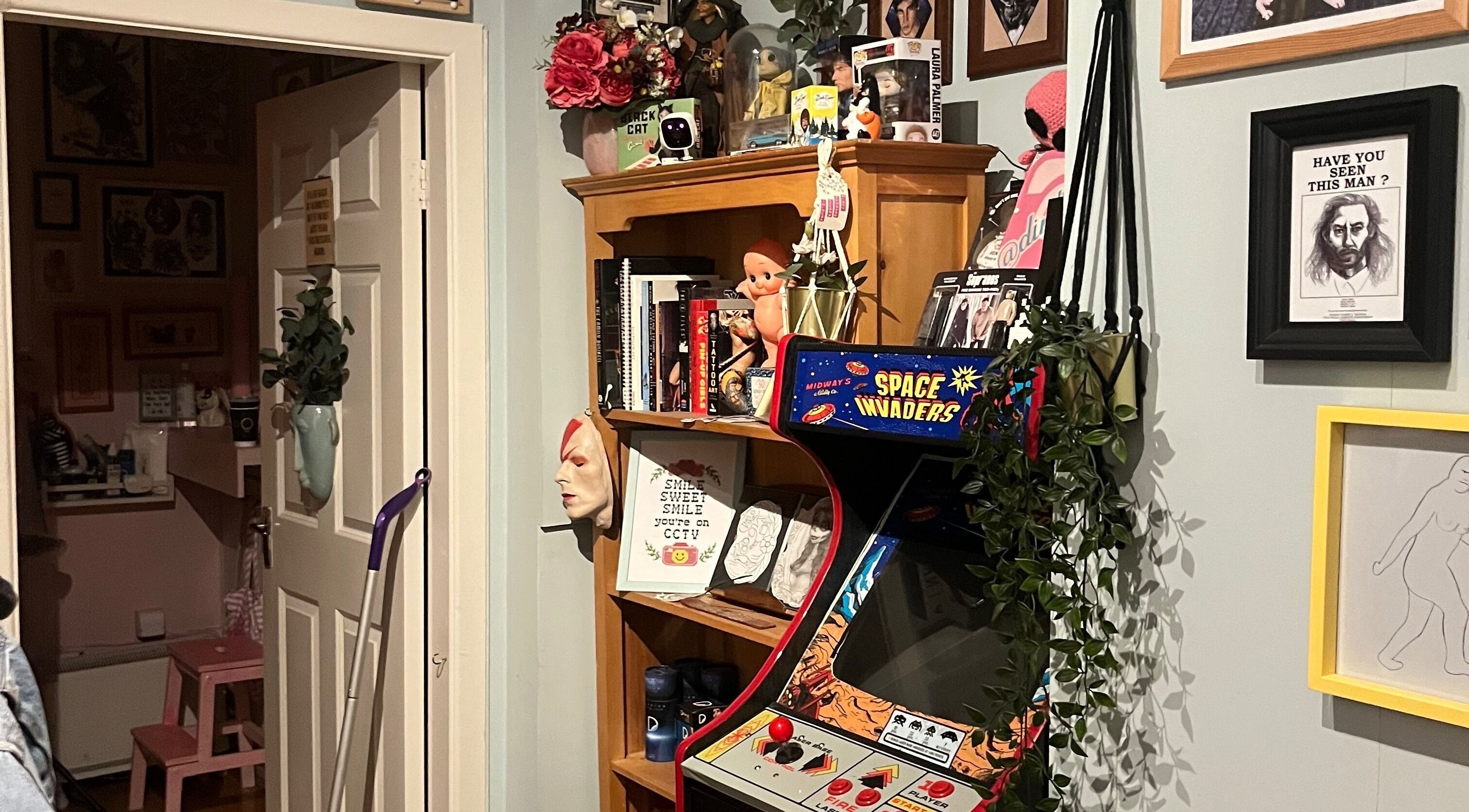 Cozy eclectic corner at Kath Mulhall Brows in Dublin, County Dublin, IE with a vintage arcade machine.