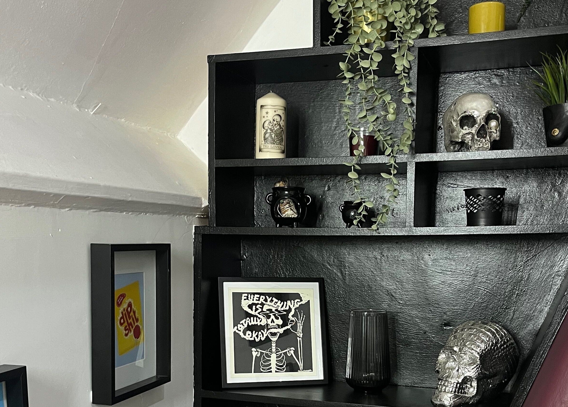 Stylish gothic shelf at Kath Mulhall Brows in Dublin, County Dublin, IE, featuring skulls and plants.