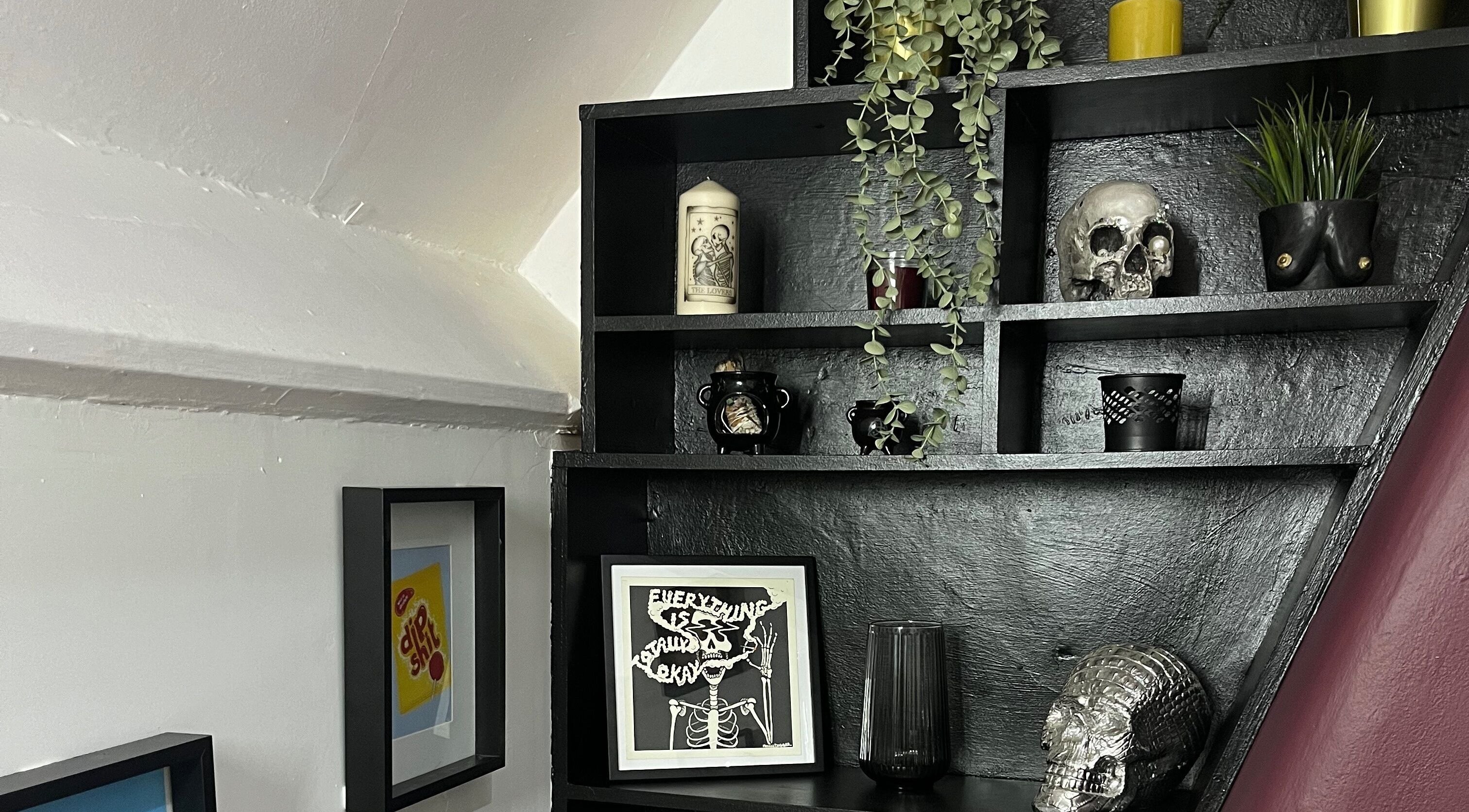 Stylish gothic shelf at Kath Mulhall Brows in Dublin, County Dublin, IE, featuring skulls and plants.