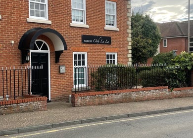 Exterior view of Hair By Ooh La La salon in Witham, England, GB, showcasing elegant brickwork and welcoming entrance.