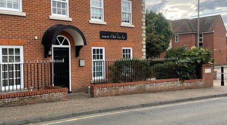 Exterior view of Hair By Ooh La La salon in Witham, England, GB, showcasing elegant brickwork and welcoming entrance.
