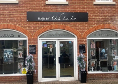 Front of Hair By Ooh La La, a stylish salon in Witham, England, GB with elegant signage and decor.