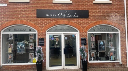 Front of Hair By Ooh La La, a stylish salon in Witham, England, GB with elegant signage and decor.