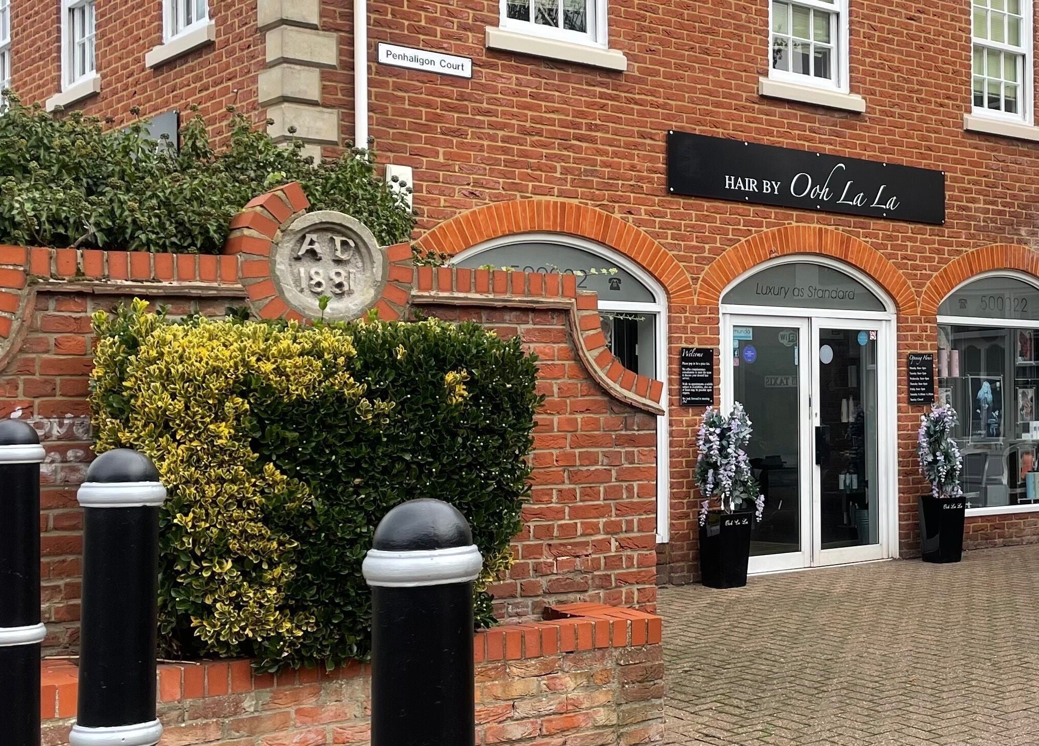 Front view of Hair By Ooh La La salon in Witham, England, GB, showcasing its stylish brick facade.