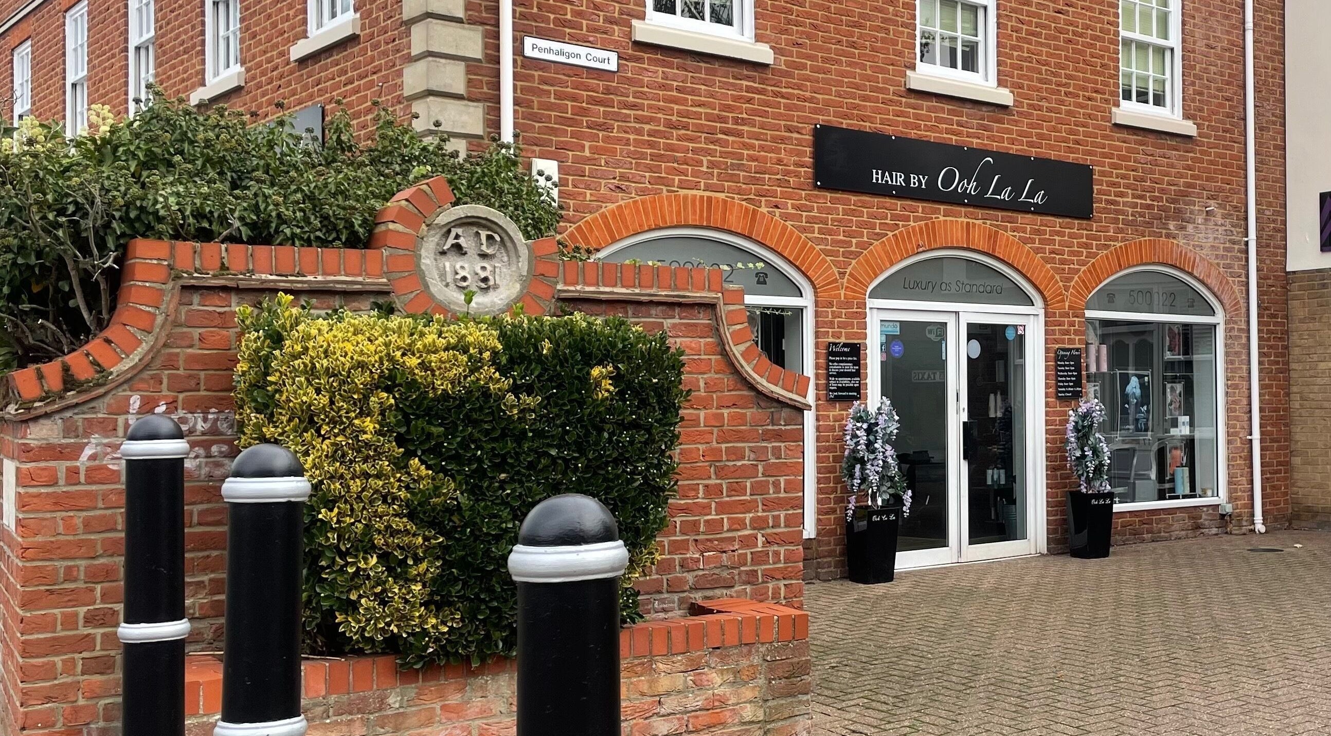 Front view of Hair By Ooh La La salon in Witham, England, GB, showcasing its stylish brick facade.